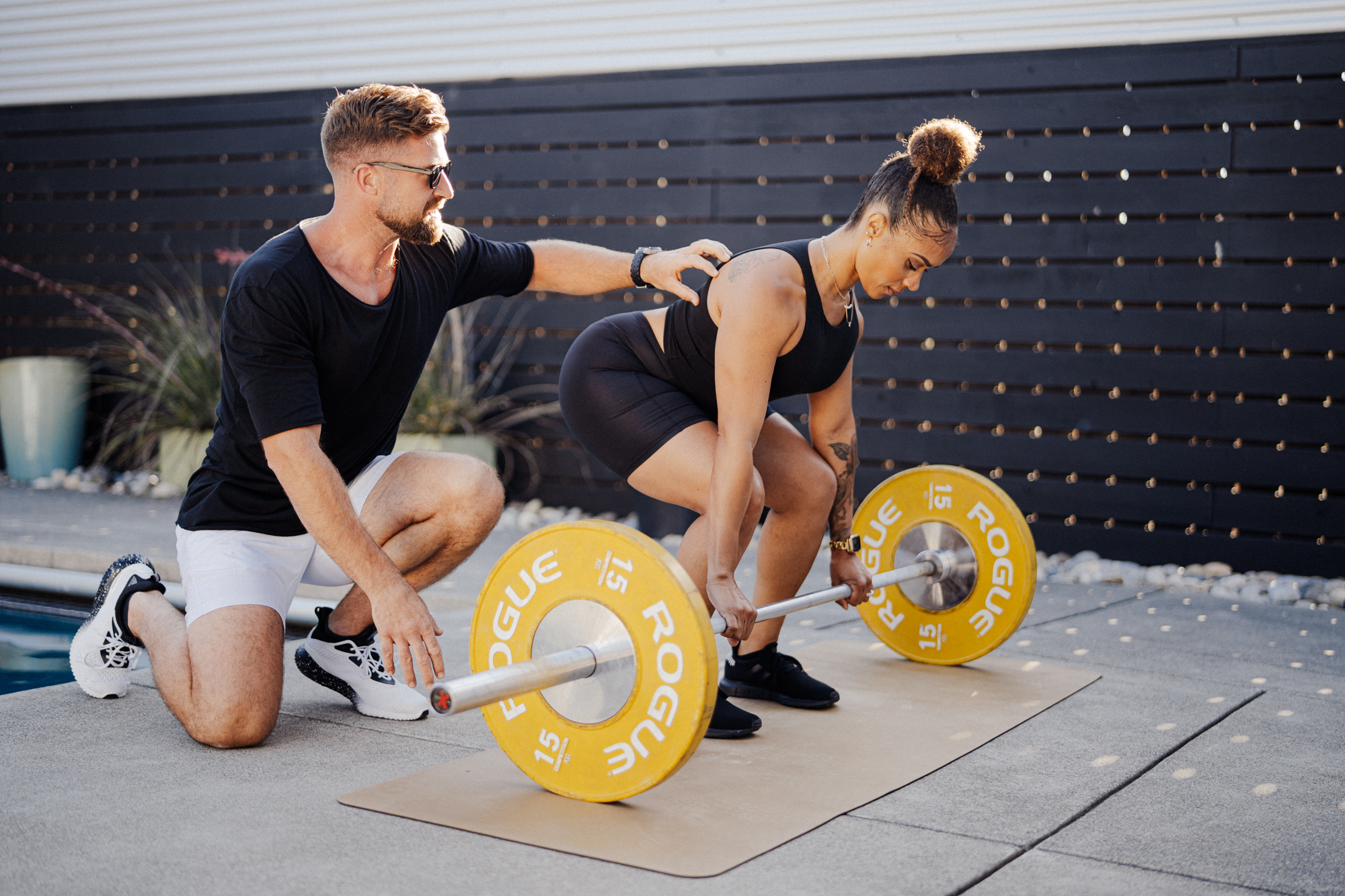 Rich coaching client on barbell